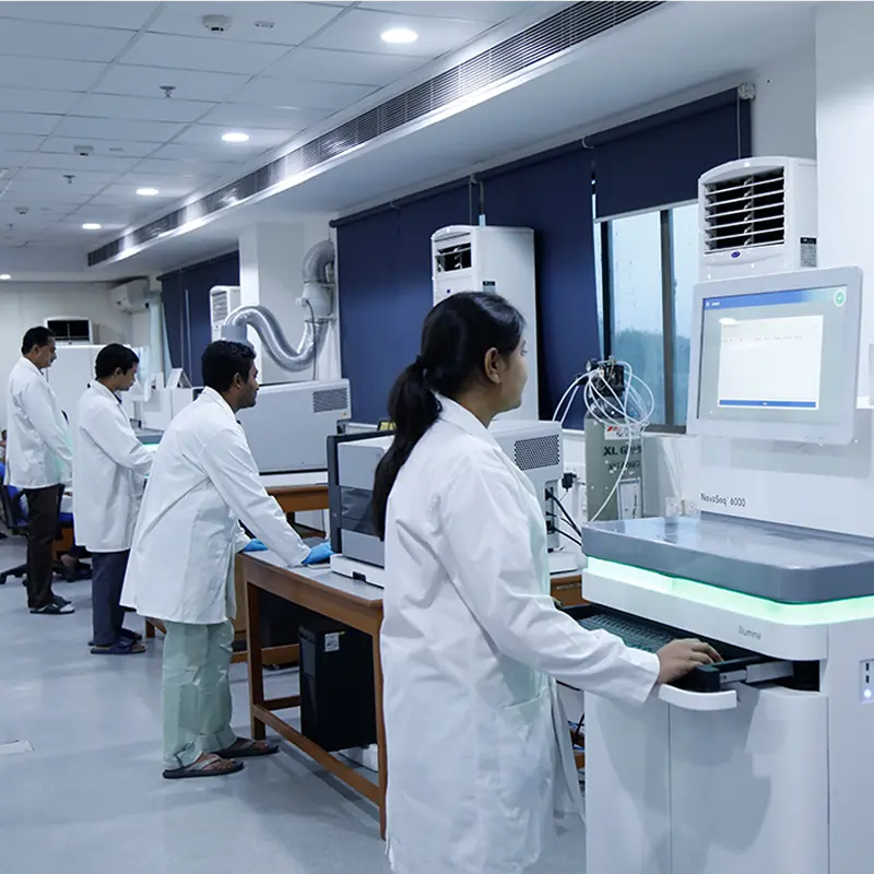 A scientist operating a high-throughput DNA sequencing instrument at NIBMG